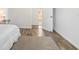 Bedroom featuring hard surface floors and a view of the bathroom at 3925 Ne 92Nd Pl, Anthony, FL 32617