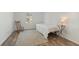 The bedroom offers a rocking chair, a side table with a lamp, and a window at 3925 Ne 92Nd Pl, Anthony, FL 32617