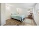 Bedroom featuring hardwood floors, a large window, and a rocking chair at 3925 Ne 92Nd Pl, Anthony, FL 32617
