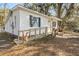 The exterior of this home features a ramp to the front door at 3925 Ne 92Nd Pl, Anthony, FL 32617