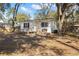 A single-story home features a ramp to the front door and mature trees at 3925 Ne 92Nd Pl, Anthony, FL 32617