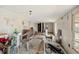 A cluttered and sparsely furnished room features panelled walls at 3925 Ne 92Nd Pl, Anthony, FL 32617