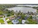 Stunning aerial view of lakeside homes, featuring beautiful landscaping and a serene lake backdrop at 12 Lake Link Dr, Winter Haven, FL 33884