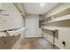 Basement includes shelving, pegboard and utility sink for optimal storage at 12 Lake Link Dr, Winter Haven, FL 33884