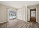 Bedroom with wood-look floors and sliding glass door leading to the pool area at 12 Lake Link Dr, Winter Haven, FL 33884