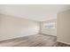 Neutral bedroom with light wood-look flooring and a window, offering a serene space at 12 Lake Link Dr, Winter Haven, FL 33884