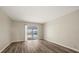 Modern living room featuring hardwood floors and sliding door access to pool at 12 Lake Link Dr, Winter Haven, FL 33884