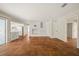 Bright living room featuring beautiful tile floors and white brick fireplace with built-in shelving at 12 Lake Link Dr, Winter Haven, FL 33884