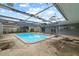 Backyard features a refreshing pool with an screen enclosure at 12 Lake Link Dr, Winter Haven, FL 33884