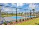 Pickleball court enclosed in a chainlink fence and set in a green space available in this community at 2918 Pennachio Dr, Lake Wales, FL 33859