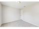 Serene bedroom with neutral carpet, a white door, and ample natural light at 3230 Baird Ave, Lakeland, FL 33805