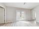 Bright bedroom with light wood floors and french doors leading to outdoor space at 3230 Baird Ave, Lakeland, FL 33805