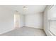 Cozy bedroom with neutral carpet, white trim and a bright window at 3230 Baird Ave, Lakeland, FL 33805