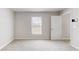 Well-lit room with neutral carpet and white trim at 3230 Baird Ave, Lakeland, FL 33805