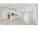 Modern kitchen featuring white cabinetry, stainless steel appliances, and a spacious center island at 3230 Baird Ave, Lakeland, FL 33805