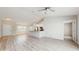 Open-concept living area with light wood flooring and lots of natural light at 3230 Baird Ave, Lakeland, FL 33805