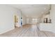 Spacious living room featuring light wood floors, recessed lighting and open to the kitchen at 3230 Baird Ave, Lakeland, FL 33805