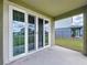 Spacious covered patio with sliding glass doors, perfect for outdoor entertaining and enjoying backyard views at 6244 Great Bear Dr, Lakeland, FL 33805