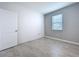 Gray bedroom features tiled floors and natural light from the window at 6244 Great Bear Dr, Lakeland, FL 33805