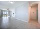 Bright living room featuring a ceiling fan, tile floors, neutral paint, and an abundance of natural light at 6244 Great Bear Dr, Lakeland, FL 33805