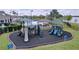 Community playground offers a variety of colorful play structures and slides for enjoyment at 6244 Great Bear Dr, Lakeland, FL 33805