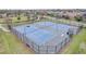 Aerial view of fenced tennis courts, offering a great recreational amenity for the community at 6244 Great Bear Dr, Lakeland, FL 33805