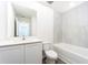 Elegant bathroom with a tub, a shower with a white tile backsplash, and modern fixtures at 3804 Corsican Pl, Lake Alfred, FL 33850
