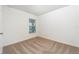 Cozy bedroom with plush carpeting, neutral paint, and a window that lets in natural light at 3804 Corsican Pl, Lake Alfred, FL 33850
