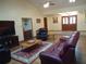 Bright living room featuring hardwood floors, vaulted ceiling and direct access to the home's entry at 1547 Belfast Ct, Apopka, FL 32712