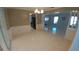 Dining area with tiled floor and open layout flows into the living room at 2502 Vine St, Orlando, FL 32806