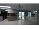 Open dining room with tiled floor and sliding glass doors to the backyard at 2502 Vine St, Orlando, FL 32806