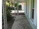 Charming front porch features decorative columns and patterned concrete flooring at 2502 Vine St, Orlando, FL 32806