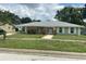 Charming single-story home featuring a well-manicured lawn and inviting front entrance at 2502 Vine St, Orlando, FL 32806