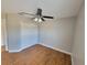 Bedroom with hardwood floors, a ceiling fan and a double door closet at 6187 Brookhill Cir, Orlando, FL 32810