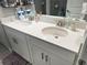 Bathroom with a double sink vanity with stone countertop and modern fixtures at 2188 Palm Tree Dr, Kissimmee, FL 34759