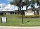 View of the Viareggio community entrance sign amidst lush landscaping and well-maintained homes, promising an inviting neighborhood at 2188 Palm Tree Dr, Kissimmee, FL 34759