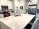 Beautiful kitchen with quartz counters, stainless steel appliances, and island with breakfast bar at 2188 Palm Tree Dr, Kissimmee, FL 34759