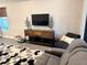 Living room features a media center and recliner seating at 2188 Palm Tree Dr, Kissimmee, FL 34759