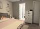 Stylish main bedroom with a decorative bed, side table, shelving, and an entrance to the ensuite bathroom at 2188 Palm Tree Dr, Kissimmee, FL 34759