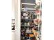 Organized pantry with shelves and baskets, filled with various food items and kitchen essentials at 2188 Palm Tree Dr, Kissimmee, FL 34759