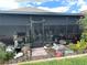 Enclosed porch featuring a screen, garden decor, and an inviting entryway at 2188 Palm Tree Dr, Kissimmee, FL 34759