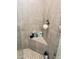 Detailed shot of the shower's tiled bench with a collection of self-care products, offering a spa-like experience at 2188 Palm Tree Dr, Kissimmee, FL 34759