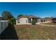 Exterior view of the back of the house, featuring a screened patio and ample backyard space at 4067 Sw 46Th Ter, Ocala, FL 34474