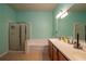 Bright bathroom with a large soaking tub, a separate glass-enclosed shower, and double vanity at 4067 Sw 46Th Ter, Ocala, FL 34474