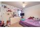 Bedroom with a full sized bed, white dresser, a tv and decor at 4067 Sw 46Th Ter, Ocala, FL 34474