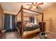 Bedroom with a wooden four poster bed and a ceiling fan at 4067 Sw 46Th Ter, Ocala, FL 34474