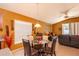 View from the kitchen shows a dining nook and Gathering room combination with a door to the back patio at 4067 Sw 46Th Ter, Ocala, FL 34474