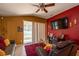 Inviting living room with a ceiling fan, decorative accents, and sliding glass doors to the patio at 4067 Sw 46Th Ter, Ocala, FL 34474