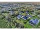 Real estate aerial depicting residential homes with green lawns and community layout at 6327 Ashley Dr, Lakeland, FL 33813