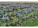 Aerial view of a residential area featuring lush greenery and single-Gathering homes at 6327 Ashley Dr, Lakeland, FL 33813